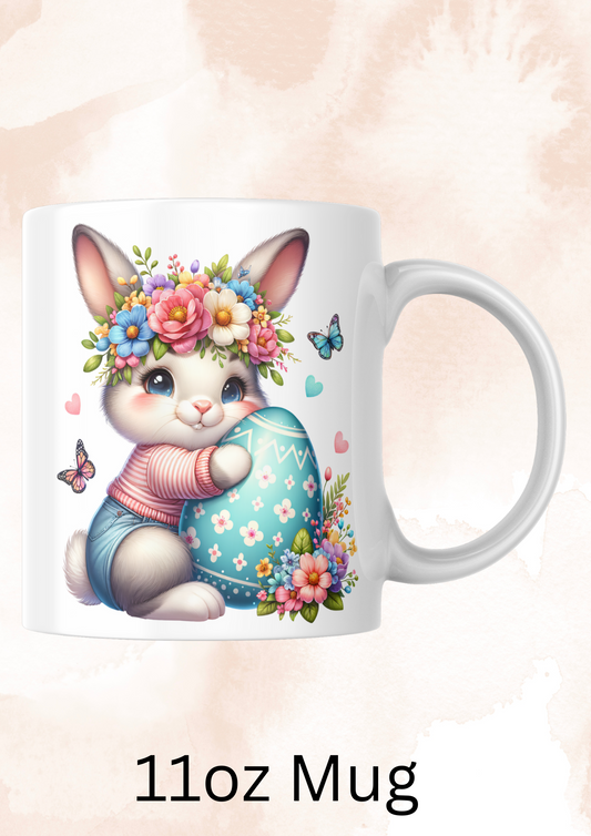 Bunny holding a blue egg mug